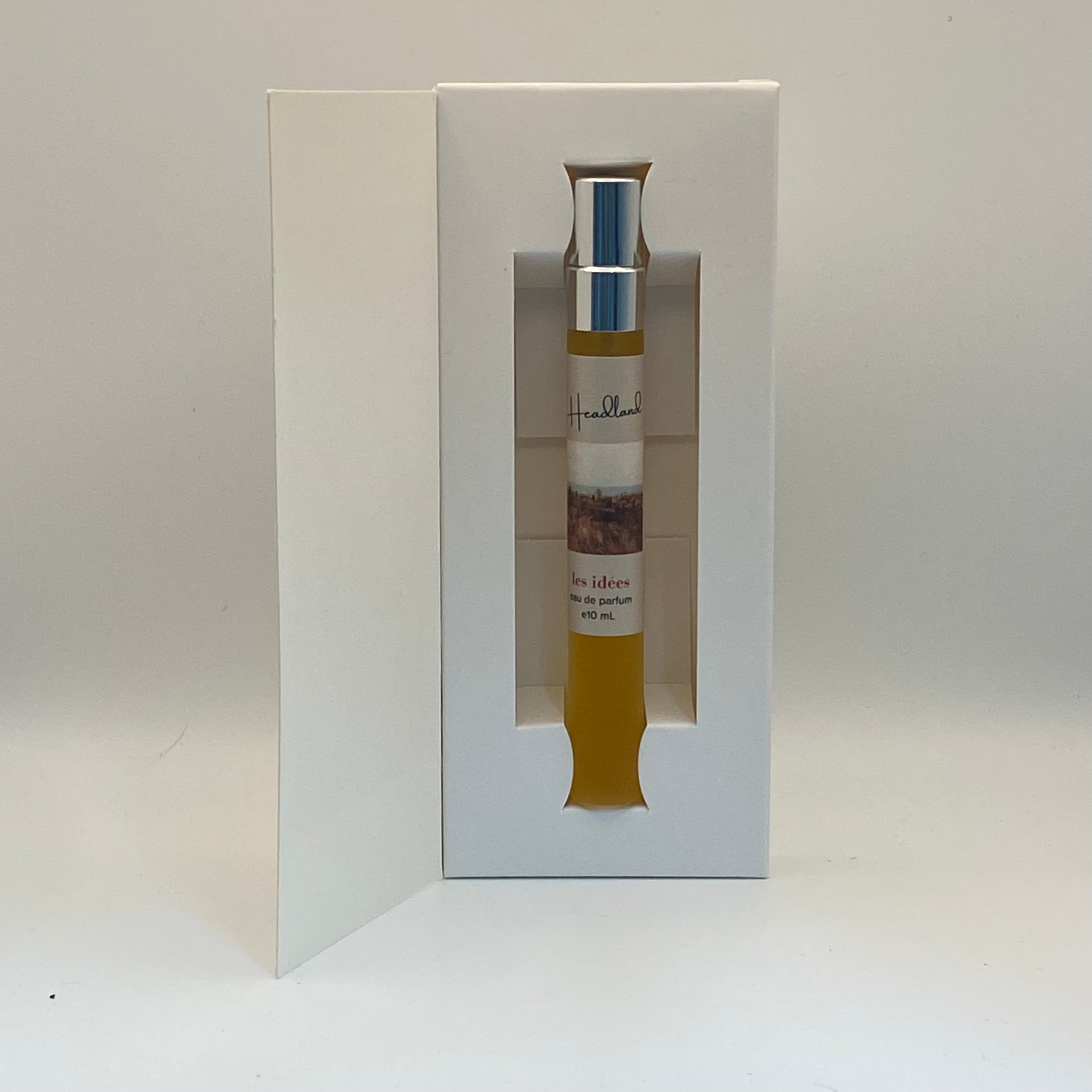 Perfume bottle with packaging on a white background