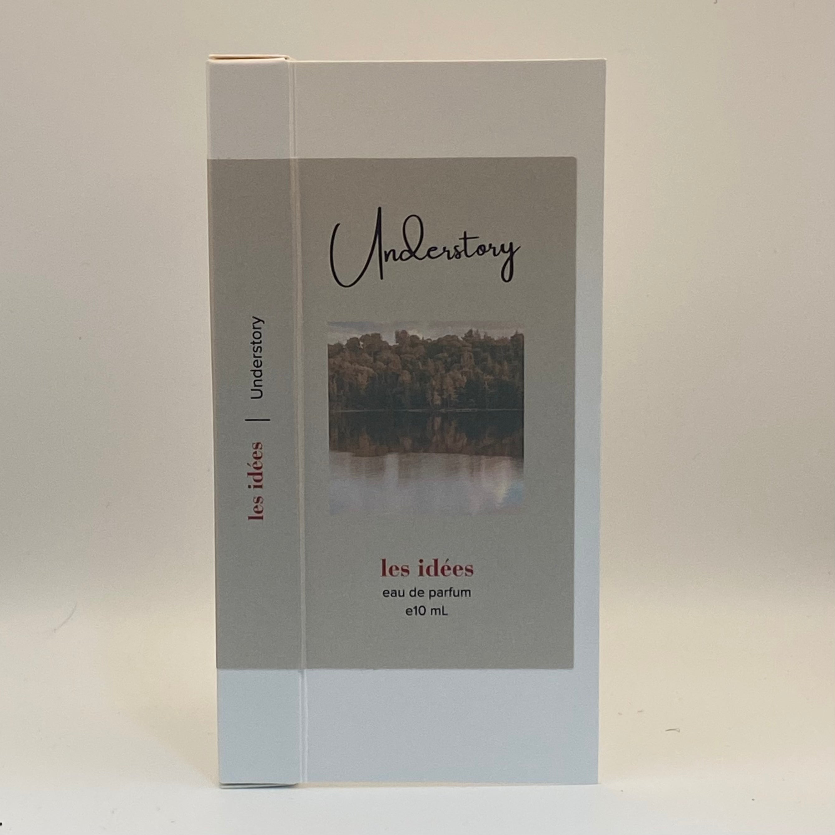 Perfume packaging with 'Understory' branding on a light gray background