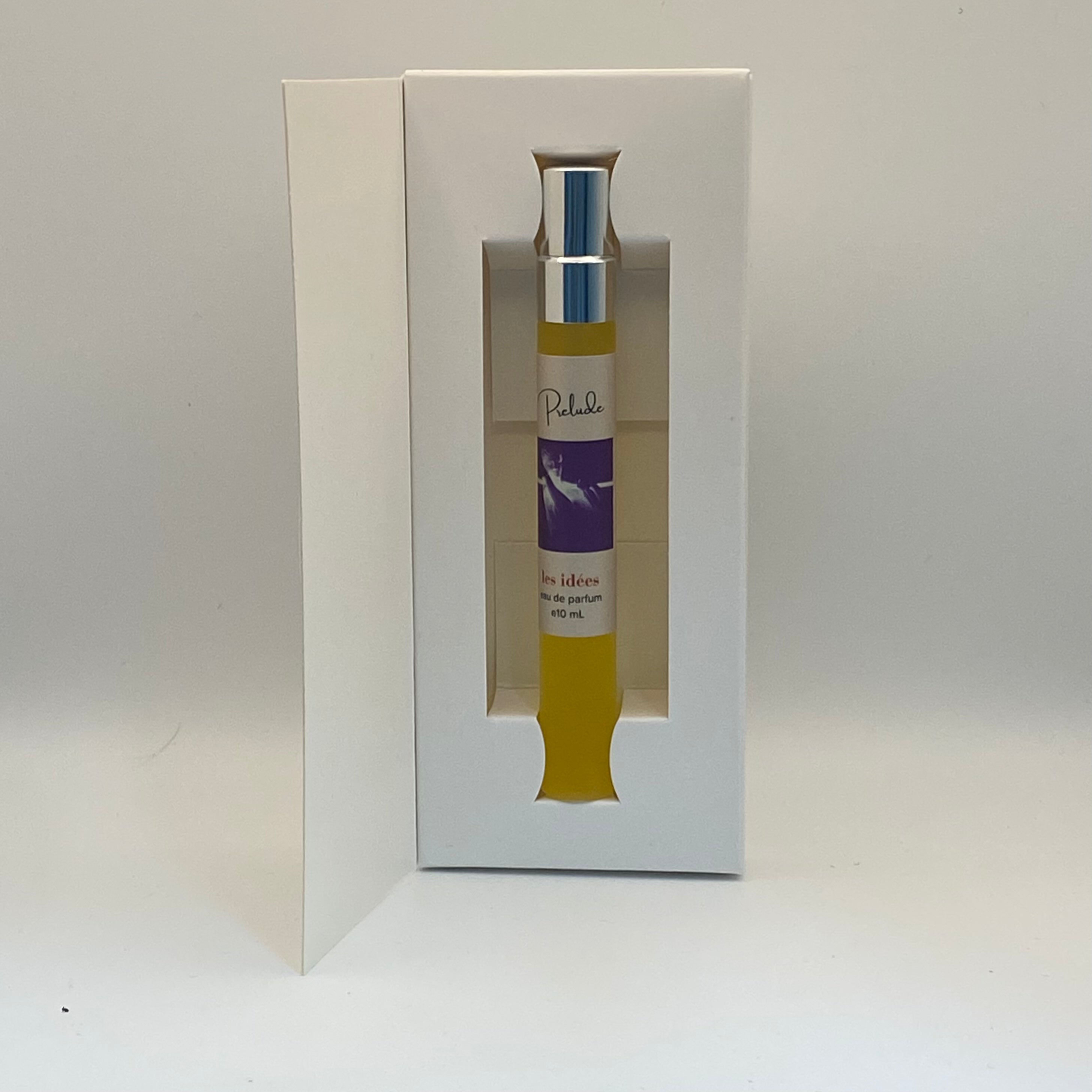 Small yellow bottle with a purple label in a white box on a light gray background